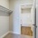 a closet with white doors