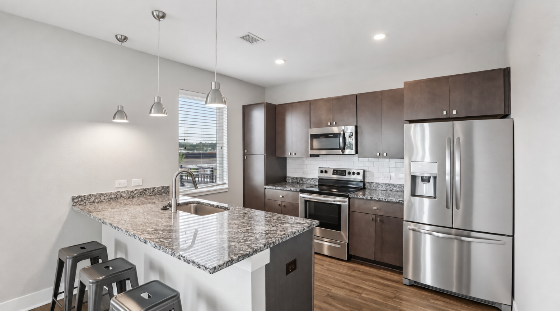 Modern apartment kitchen with granite countertops