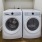 a washing machine and dryer in a room