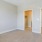 a bedroom with a ceiling fan