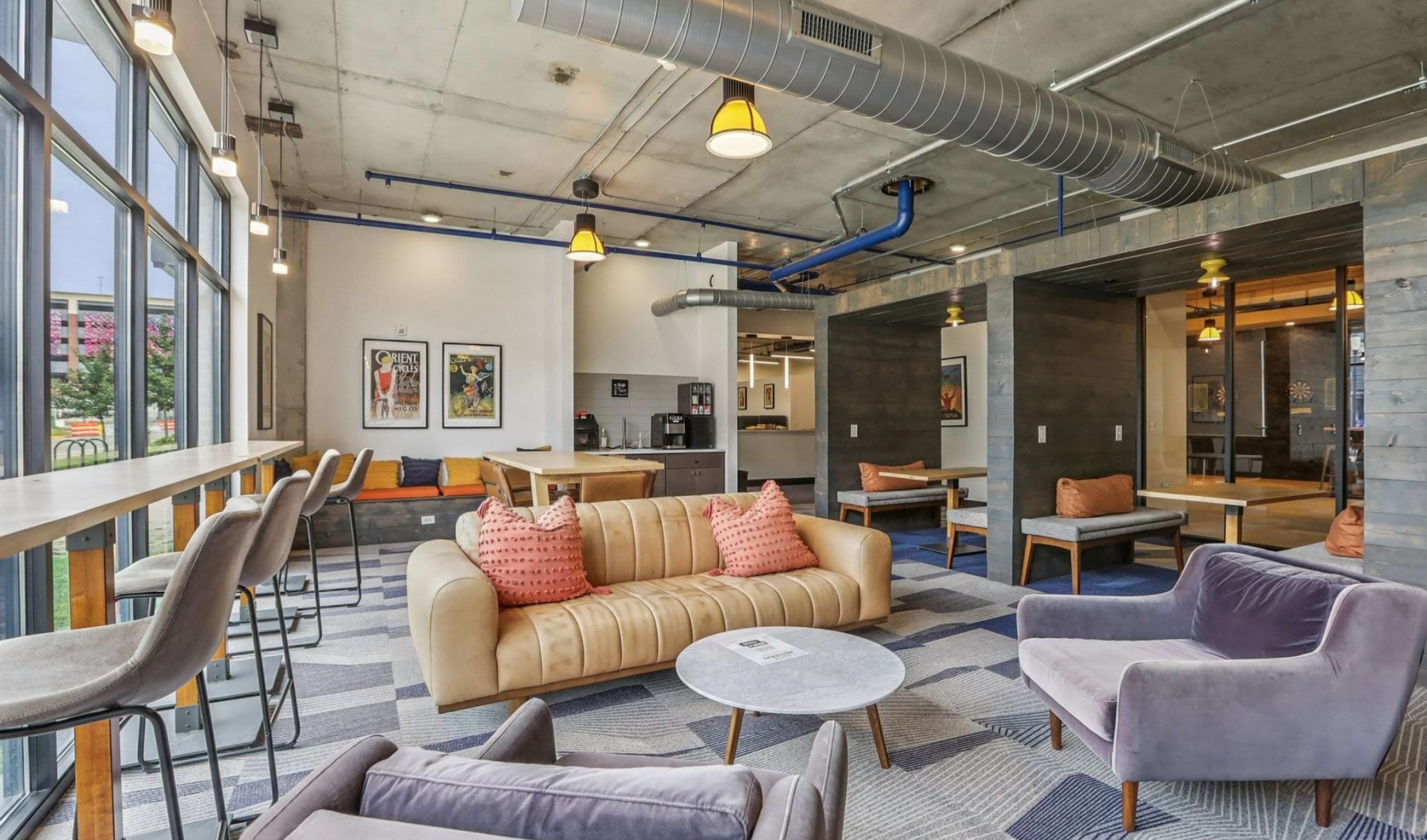 leasing lounge with couches and windows